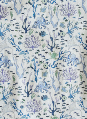 The Timo & Violet Baby Walker Terry Onesie features a playful print of blue and purple octopuses, fish, seaweed, and coral on white—ideal for eco-friendly baby clothes.