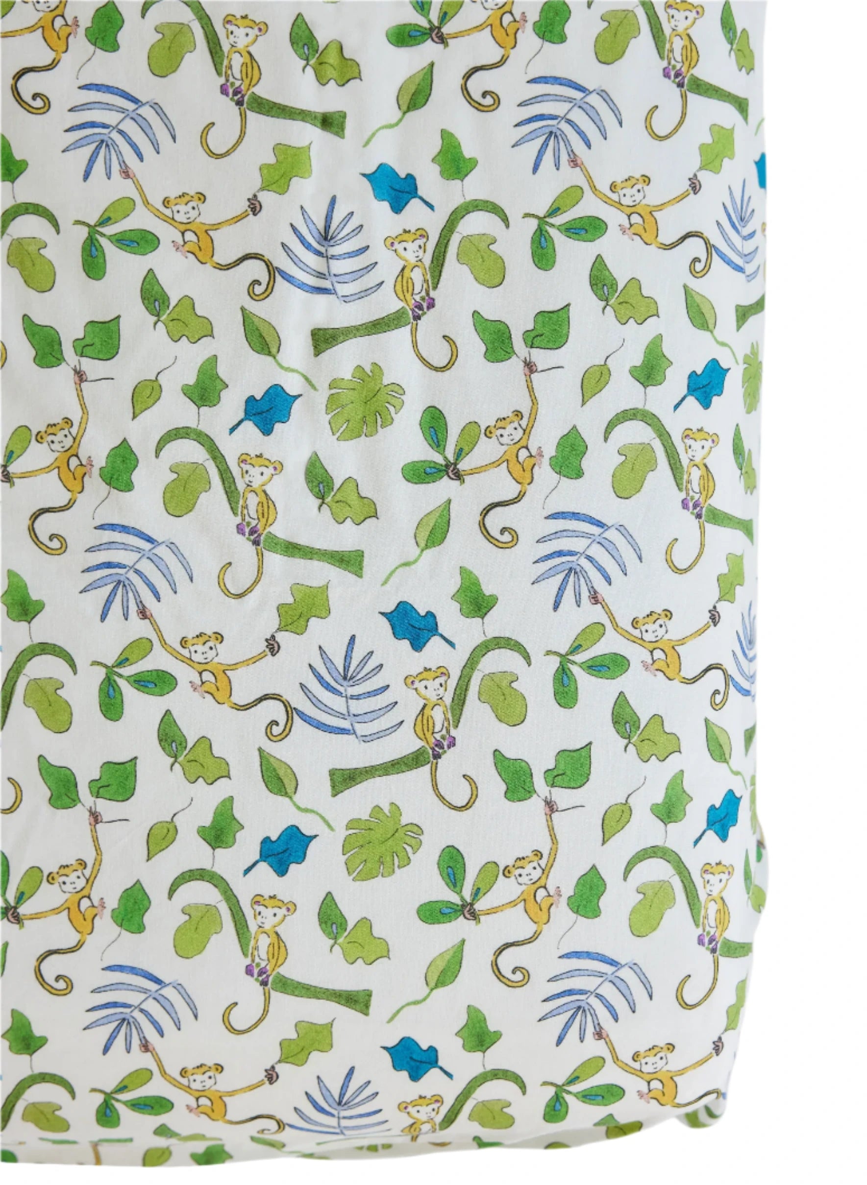 Timo & Violet's Crib Sheet features soft white fabric with yellow monkeys hanging from green vines, surrounded by green and blue leaves—perfect breathable bedding for your little one.