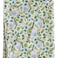 The Timo & Violet Hooded Bath Towel features a playful monkey, green leaf, and blue flower pattern on white. Ideal for kids as a cozy bath towel with a hood for extra warmth and fun.