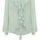 Light green Victoria Beckham Romantic Blouse with ruffled front and long sleeves on a white background.