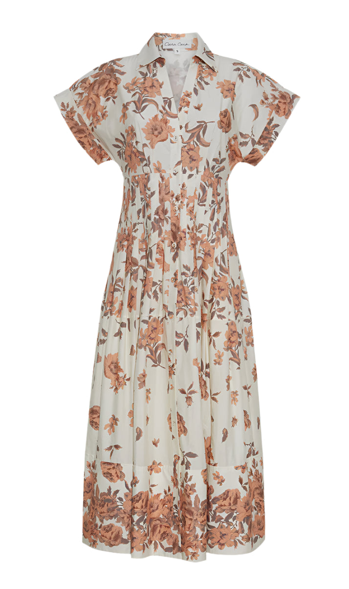 The Nash Midi Dress by Cara Cara is a fit and flare midi shirt dress with a beige base, brown floral print, collared neckline, and short sleeves.