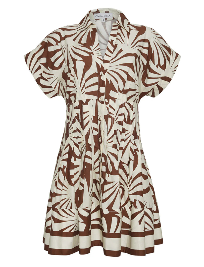 The Nash Mini Dress by Cara Cara is a short-sleeved, button-front shirtdress featuring a brown and white abstract leaf print and a fit-and-flare silhouette.