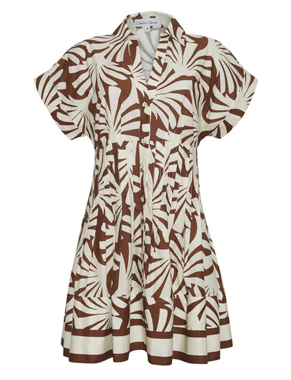 The Nash Mini Dress by Cara Cara is a short-sleeved, button-front shirtdress featuring a brown and white abstract leaf print and a fit-and-flare silhouette.