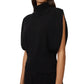 A woman wears the Zaya Top by Lisa Yang, a sleeveless black cashmere top featuring a high neck, wide arm openings, and ribbed detailing at the waist and neck.