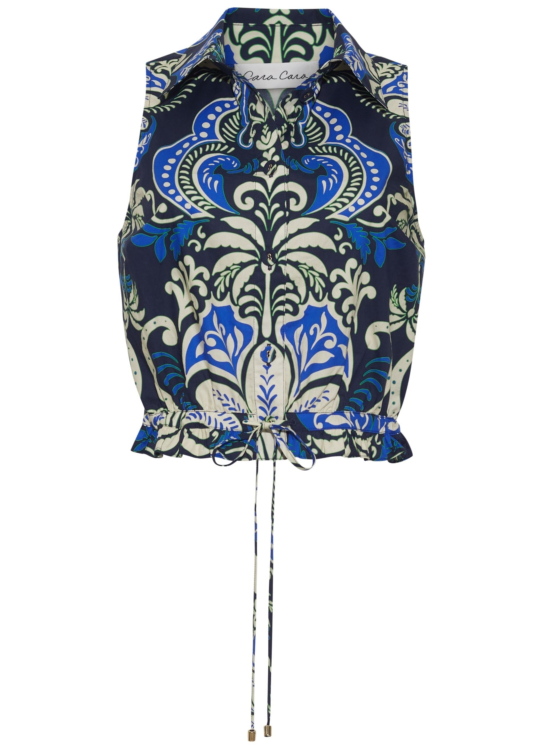The Hannah Top by Cara Cara is a sleeveless collared halter with a blue, green, and white ornate floral pattern, featuring a button-down bodice and an adjustable drawstring hem.
