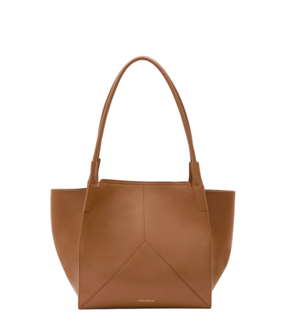 The Small Victoria Tote by Victoria Beckham, crafted in smooth calf leather, features two handles, subtle stitching, and a minimalist design, displayed against a plain white background.
