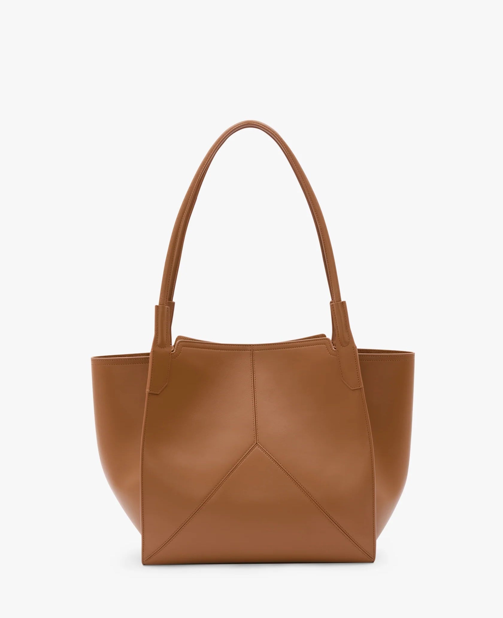 The Small Victoria Tote by Victoria Beckham, made from smooth tan calf leather, features two long handles and a minimalist design, displayed on a plain white background.