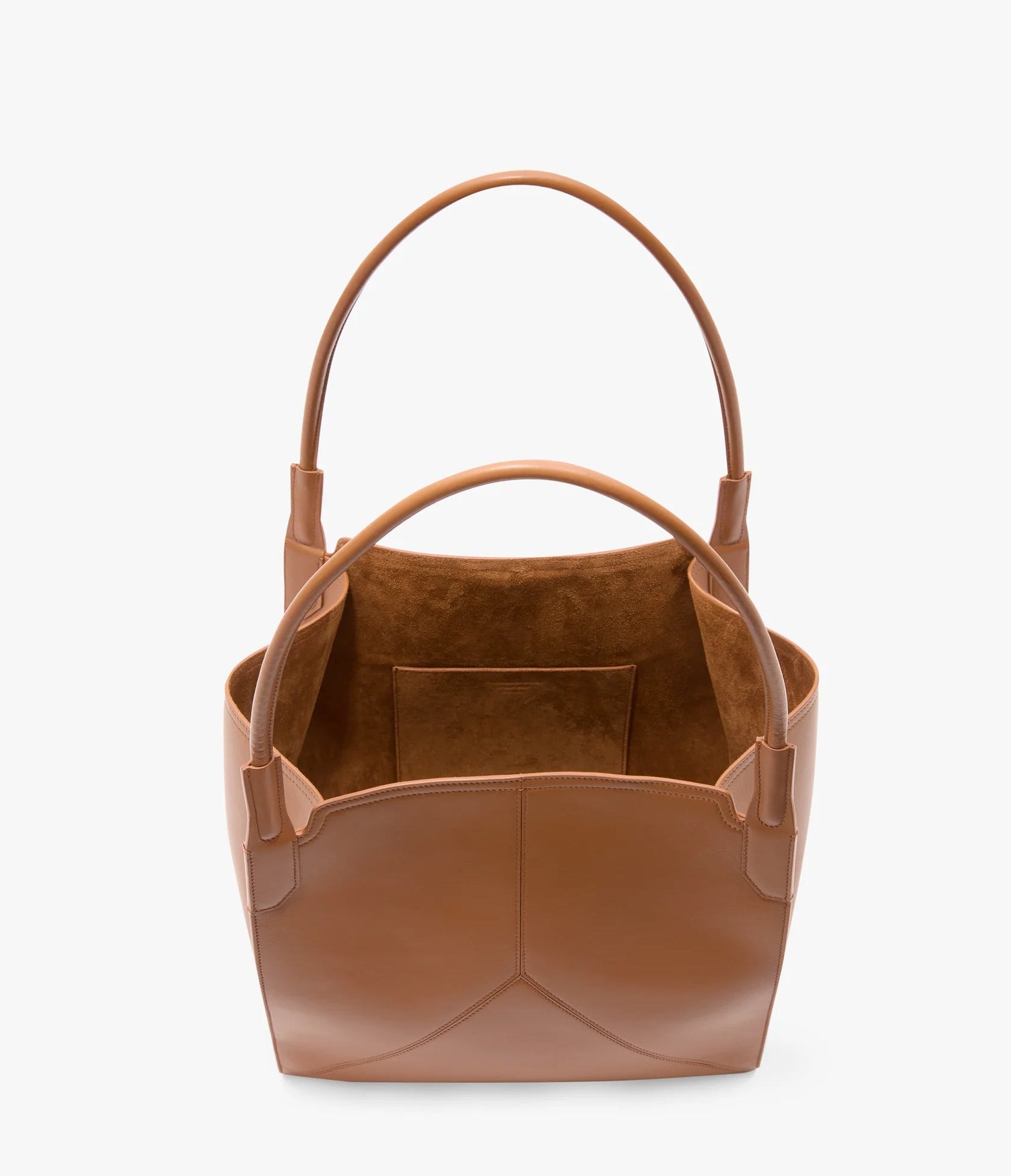 The Small Victoria Tote by Victoria Beckham, made from smooth tan calf leather, has two handles, an open top, and an interior pocket, shown against a white background.