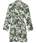 The Henry Dress by Cara Cara is a long sleeve, button down mini dress with a green leaf and floral print on white, featuring a flattering drawstring waist.