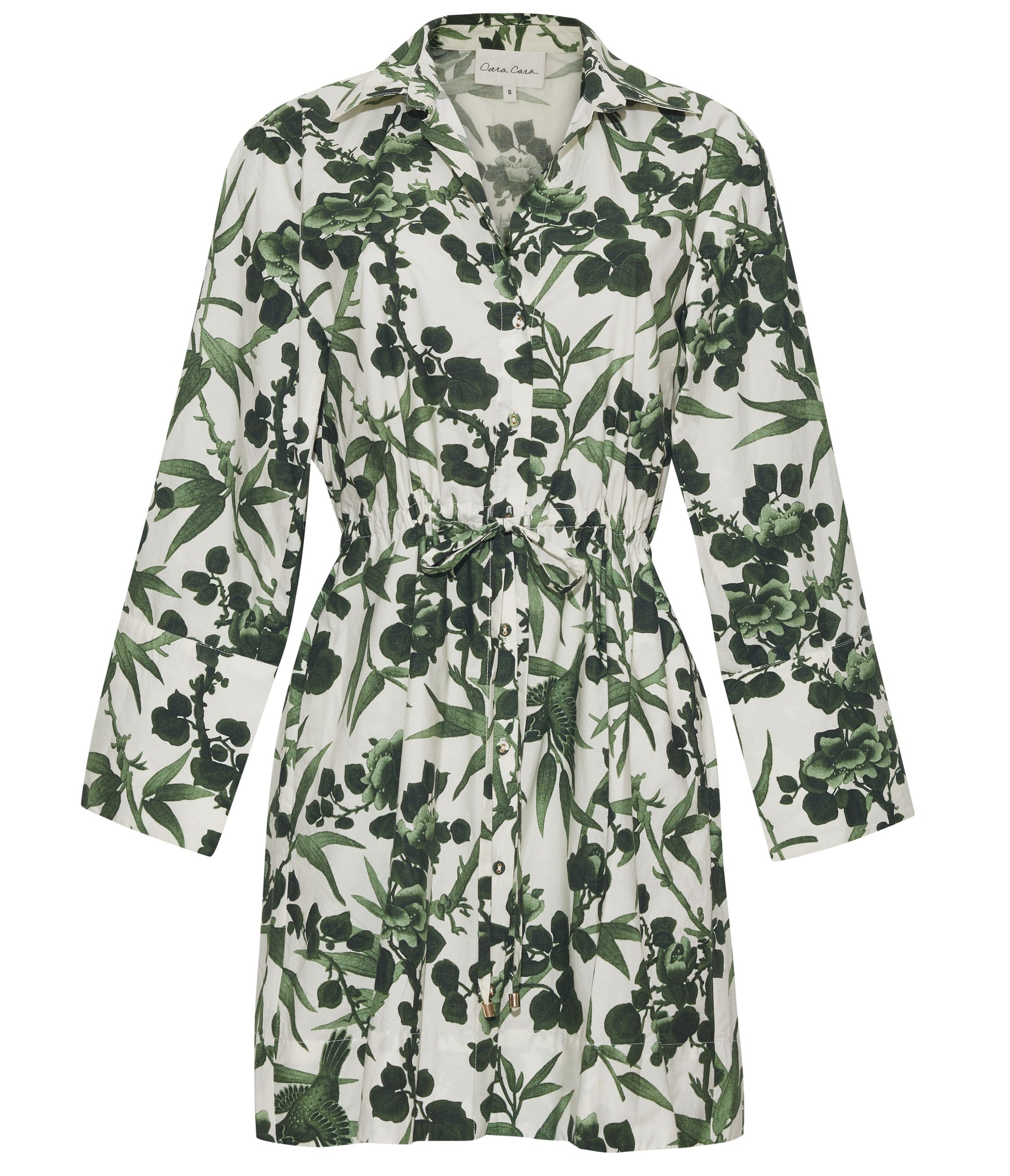 The Henry Dress by Cara Cara is a long sleeve, button down mini dress with a green leaf and floral print on white, featuring a flattering drawstring waist.