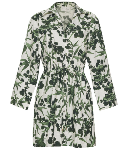 The Henry Dress by Cara Cara is a long sleeve, button down mini dress with a green leaf and floral print on white, featuring a flattering drawstring waist.