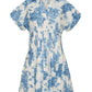 The Nash Mini Dress by Cara Cara features short sleeves, a button-down front, and a fit-and-flare silhouette with a blue floral print on white for a flattering look.