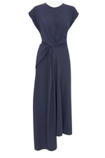 The Victoria Beckham Aria Twist Waist Dress is a sleeveless navy blue midi in luxe crepe back satin, with a round neckline and an asymmetrical draped knot at the waist for an Eclipse-inspired look.