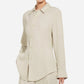 A person wears the CO Fitted Collared Shirt in beige with matching pants, standing against a plain white background.