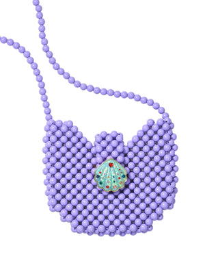 The Super Smalls Mermaid Dreams Handbag is a purple beaded crossbody bag featuring a seashell-shaped clasp and a beaded shoulder strap, shown on a white background.