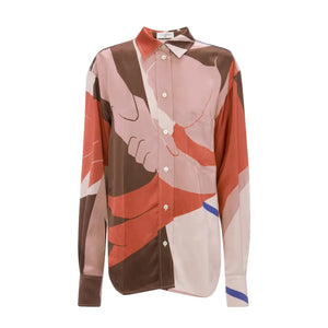 The Remi Shirt by Victoria Beckham is a long-sleeve button-up in printed satin crepe, featuring a multicolor abstract design with shades of brown, red, pink, and blue.