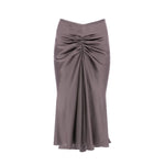 The Victoria Beckham Bela Skirt is a long, high-waisted taupe grey crepe back satin skirt with front ruching and a slight flare at the hem for a polished look.