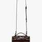 The Vanity Croc Crossbody by Victoria Beckham is a dark brown rectangular bag in croc-embossed leather, with a gold zipper, short top handle, adjustable strap, and organized compartments for convenience.
