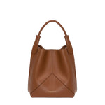The Victoria Bucket by Victoria Beckham features a modern look in dark tan nappa leather, with a single handle, visible seam details, and the brand’s logo on the lower front.