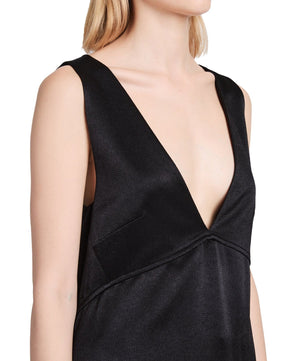 A person wearing a Proenza Schouler Liz Top by Proenza Schouler with a deep V-neck neckline, showcasing the classic sleeveless silhouette.