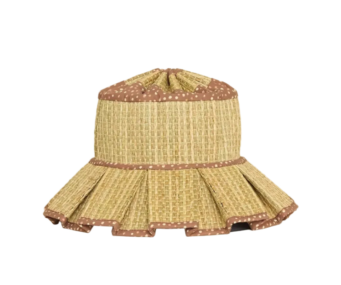 Introducing the Luxe Beauty Point Hat by Lorna Murray: a stylish wide-brimmed woven straw sun hat, adorned with brown polka dot fabric trim along the top and brim and a distinctive pleated design—an essential UPF 50+ accessory for chic travel.