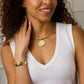 Woman wearing the Jane Win Love Set in Stone Heart Cuff, paired with a white sleeveless top.