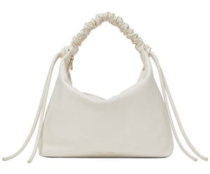 The Proenza Schouler Medium Drawstring Shoulder Bag is crafted from smooth leather, showcasing a white ruched design with a knotted strap and side ties. This minimalist piece is elegantly highlighted by a subtle gold foil logo on the plain background.