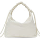 The Proenza Schouler Medium Drawstring Shoulder Bag is a white medium shoulder bag made from smooth leather, featuring a ruched handle and drawstring details on both sides, finished with an elegant gold foil logo.