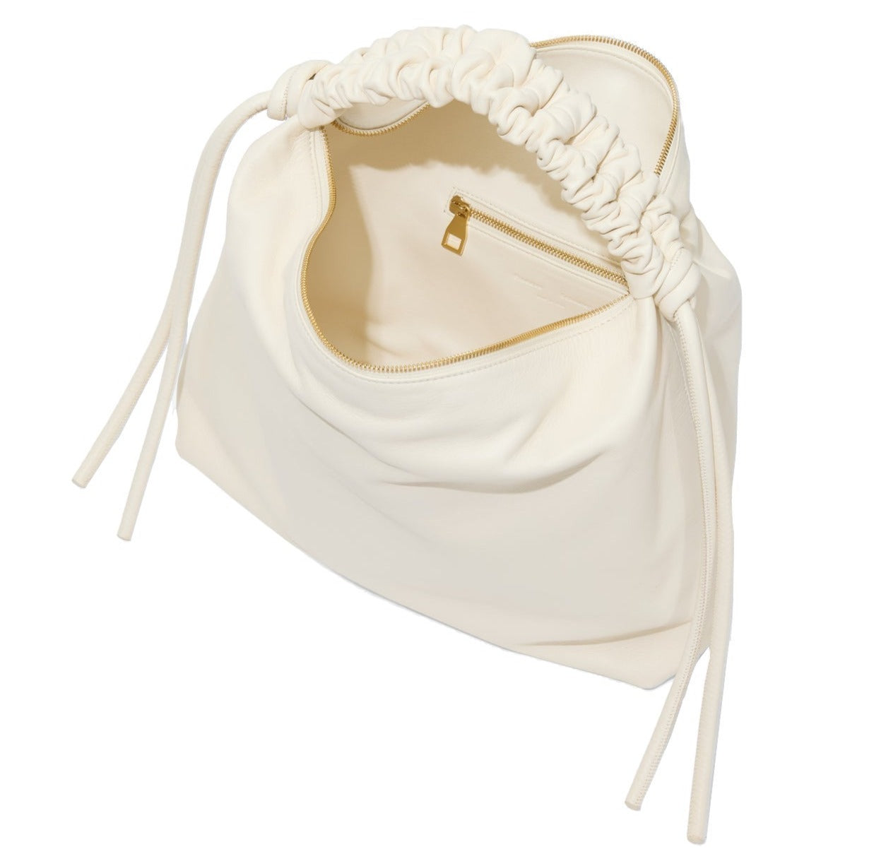 The Proenza Schouler Medium Drawstring Shoulder Bag is a cream-colored shoulder accessory made from smooth leather, featuring an open top that unveils an interior zippered pocket and a subtle gold foil logo.