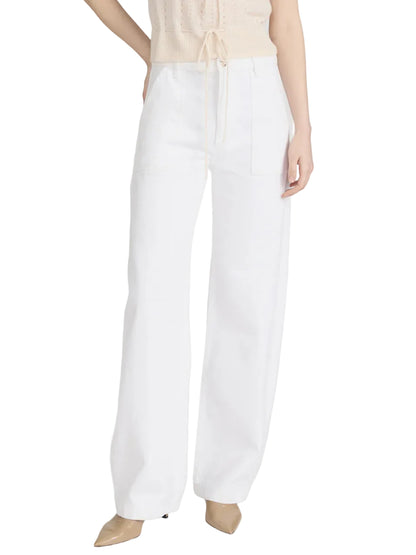 A person wearing Frame's The Bow Cargo high-waisted, wide-leg white pants with a utilitarian vibe, a sleeveless beige top, and beige pointed-toe shoes.