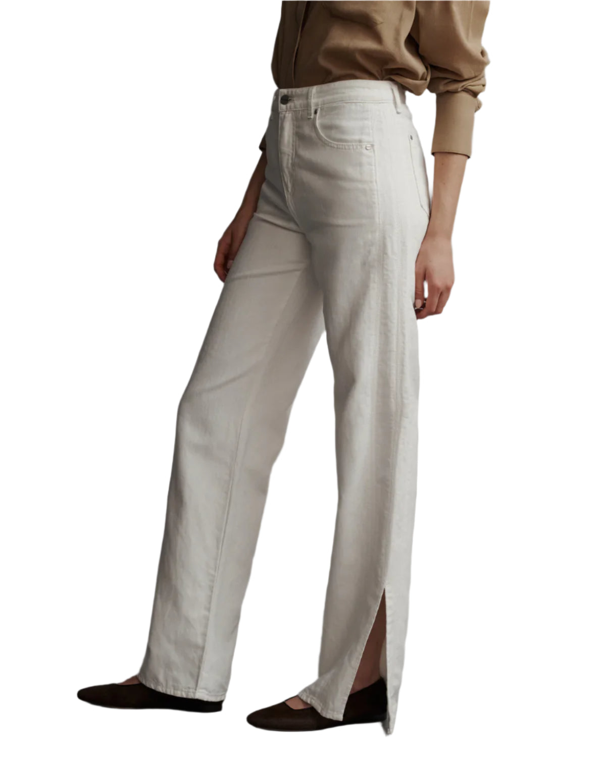 A person styled in a TWP beige shirt and TWP Tangled Up In Blue Pant, featuring white high-waisted, wide-leg design with a side slit, paired with classic black five-pocket shoes.