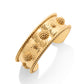 The Berry Classic Cuff by Juliska Capucine De Wulf is a gold cuff bracelet featuring a hammered texture, raised beaded spheres, and twisted rope edges. Photographed on a white background, it adds the perfect statement to any look.