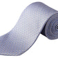 The Eton Geometric Print Silk Tie, in light blue with a subtle geometric pattern, is neatly rolled and displayed on a white background.