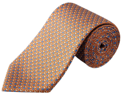 The Eton Geometric Print Silk Tie is crafted from refined twill and features a rolled-up orange design with blue and white geometric accents.