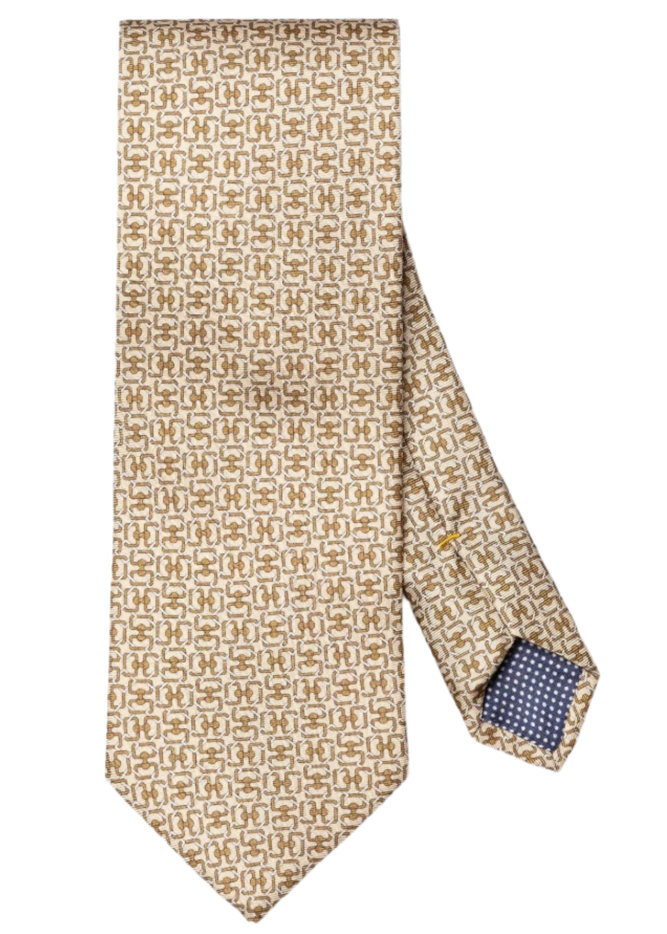The Eton Geometric Print Silk Tie in beige and gold features a repeating pattern and is shown flat with its tip tucked, revealing blue and white lined inner fabric.