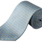The Eton Geometric Print Silk Tie features a blue silk base with yellow and white geometric patterns, ideal for classic suiting. Shown rolled up on a white background.
