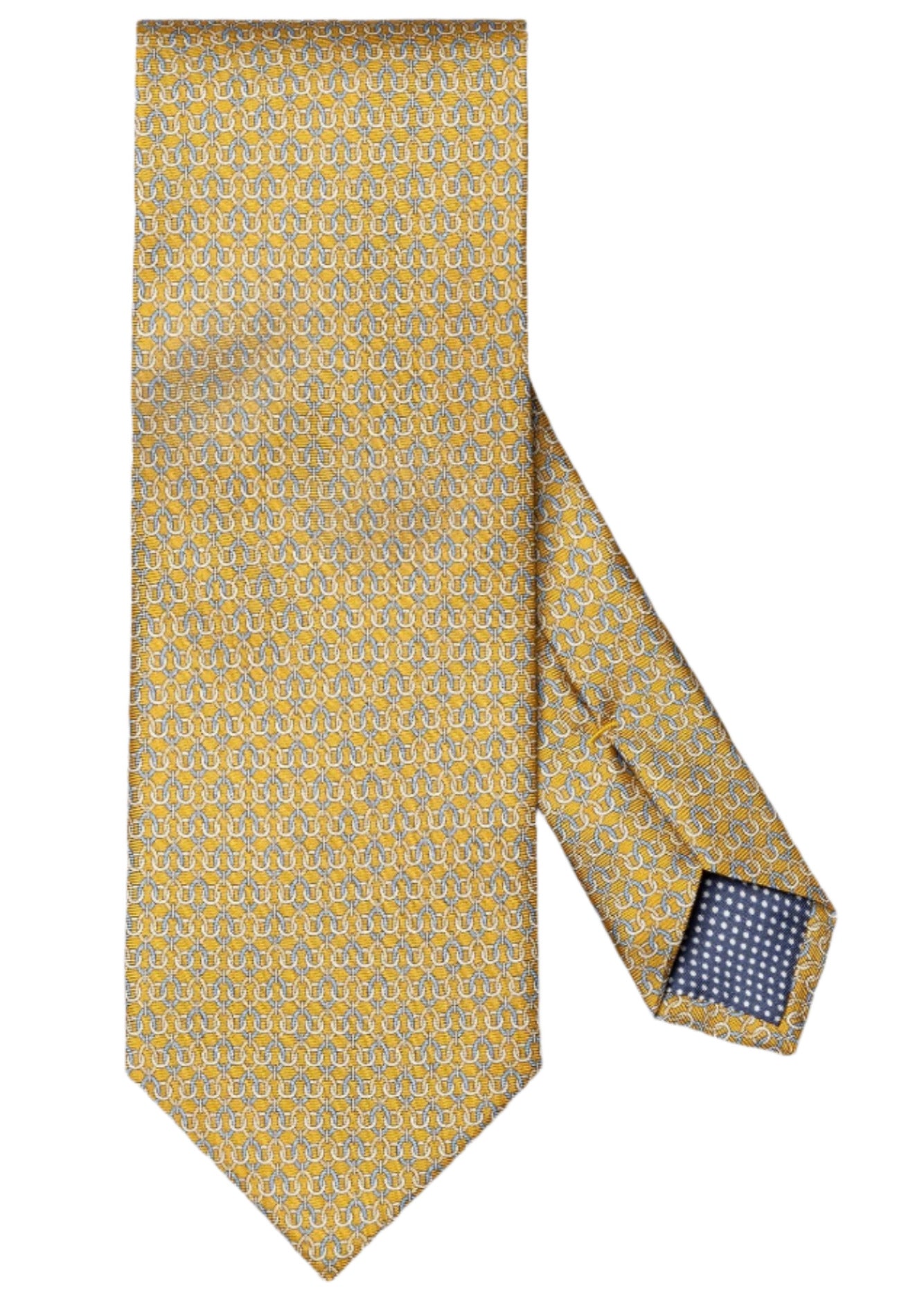 The Eton Geometric Print Silk Tie features a yellow base with blue and white small geometric patterns, classic suiting style, and a navy lining with white dots at the inside tip.