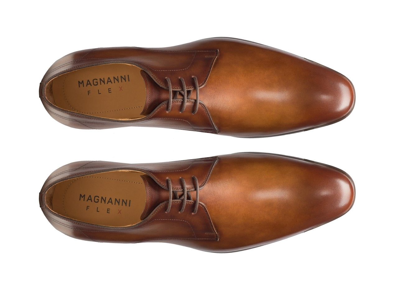 A pair of Magnanni Maddin Lace-Up calfskin plain toe derby shoes on a white background.