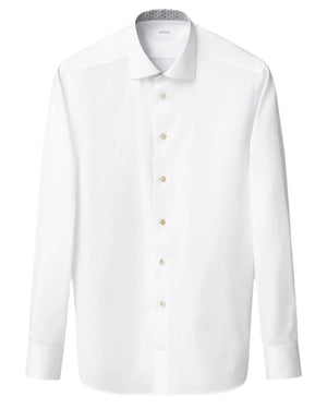 The Eton Slim Cut Away Medallion Effect Signature Twill Shirt is a white organic cotton dress shirt with long sleeves, a spread collar, and beige buttons, showcased against a plain background.