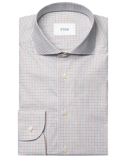 The Eton Slim Cut Away Micro Check Twill Shirt is a long-sleeve, button-up dress shirt in light blue and beige micro check, made from organic cotton.