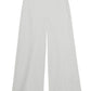 The Simkhai Kallin Cropped Wide Leg Pant in white features a high-waisted, wide-leg design with a clean, tailored finish, crafted from heavy cotton and shown laid flat on a plain background.
