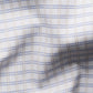 Close-up of the Eton Slim Cut Away Check Supima 120 Shirt, featuring white organic Supima cotton in a blue and tan plaid pattern with visible texture, crafted in luxurious piqué by the renowned Albini mill.