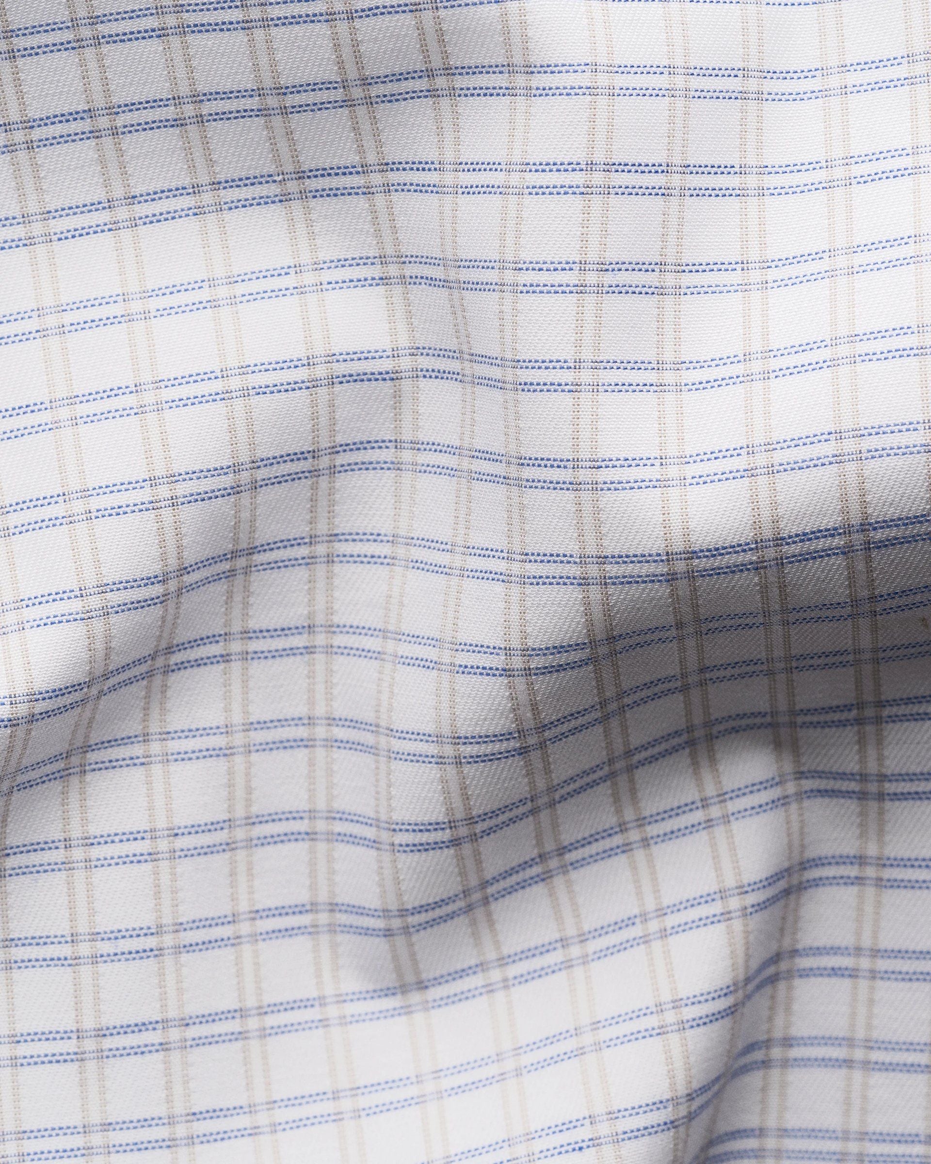 Close-up of the Eton Slim Cut Away Check Supima 120 Shirt, featuring white organic Supima cotton in a blue and tan plaid pattern with visible texture, crafted in luxurious piqué by the renowned Albini mill.