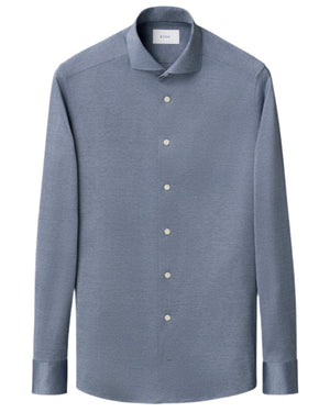 The Eton Slim Wide Spread Filo di Scozia Knit Shirt is a light blue, long-sleeve, button-up with a spread collar and white buttons, shown on a white background.