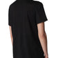 A person in a Cashmere Tee by CO, featuring a relaxed silhouette, stands facing away against a plain white background.