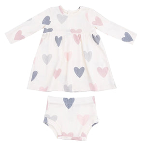 The Angel Dear AD Modal Rib Simple Dress + Bloomer set features a cozy white long-sleeve dress with matching bloomers, both adorned with pink, blue, and grey heart patterns.