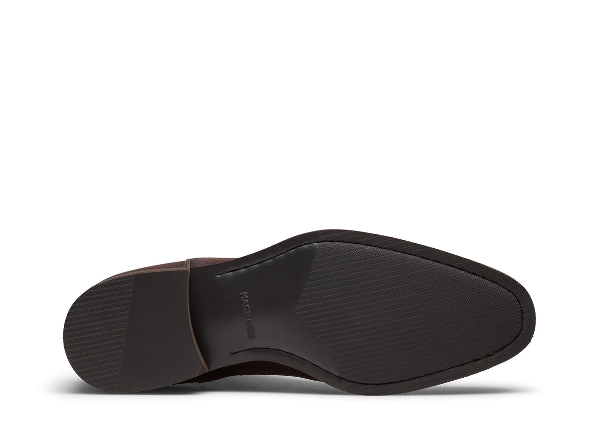 A brown full-grain leather Lonny Chelsea boot viewed from the sole.