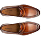 Top-view image of Magnanni's Daniel Loafer, a brown leather penny loafer with visible stitching and a smooth finish. It features classic design elements and includes Línea Flex insoles labeled "Magnanni Flex.