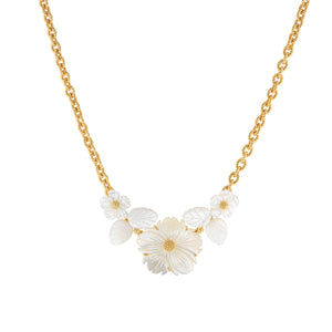 The Juliska Capucine De Wulf Mermaid Garden Bouquet Necklace is a gold link chain with three white carved flower and leaf accents at the center, creating a stunning statement piece.