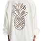 Person wearing a Dorothee Schumacher Poplin Power Pineapple Blouse by Dorothee Schumacher with a large pineapple embroidery on the back.